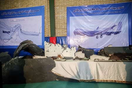 The purported wreckage of the American drone is seen displayed by the Islamic Revolution Guards Corps (IRGC) in Tehran