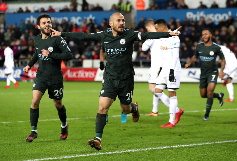 David Silva celebrates one of his two goals against Swansea on Wednesday. (Getty)