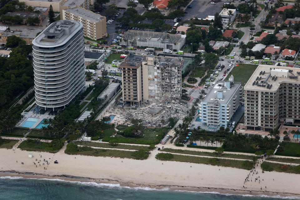 Search and rescue personnel work in the rubble of the 12-story condo tower that partially collapsed on June 24, 2021 in Surfside, Florida.  / Credit: Getty Images