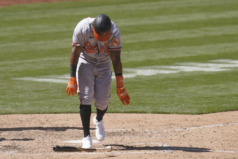 Baltimore Orioles' Maikel Franco throws down his bat after striking out against the Oakland Athletics during the seventh inning of a baseball game in Oakland, Calif., Sunday, May 2, 2021. (AP Photo/Jeff Chiu)