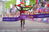 Stephen Kiprotich of Uganda celebrates as he approaches the line to win gold in the Men's Marathon on Day 16 of the London 2012 Olympic Games at The Mall on August 12, 2012 in London, England. (Photo by Stu Forster/Getty Images)