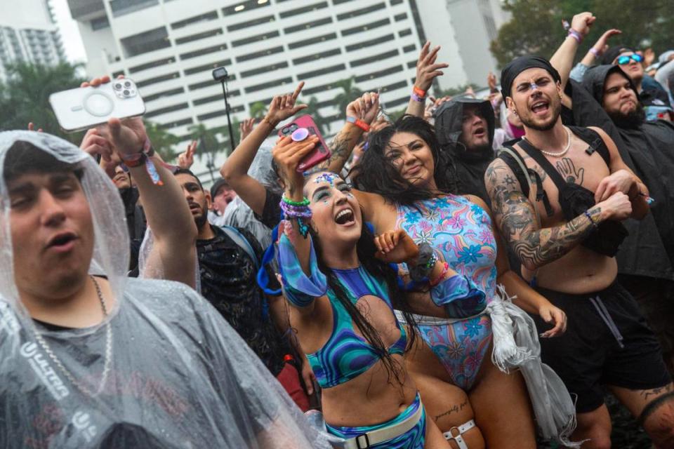 People dance in the rain during Ultra 2024 at Bayfront Park in Downtown Miami on Friday, March 22, 2024.