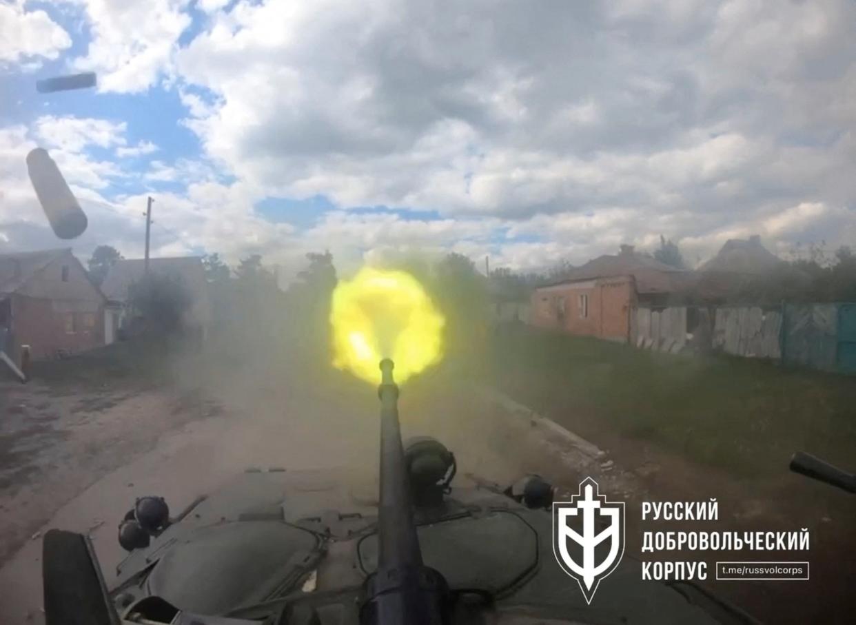 A weapon on an armoured vehicle with the Russian forces is fired in Vovchansk, Kharkiv Oblast (via REUTERS)