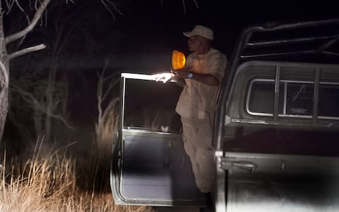 The Telegraph on patrol with Ruri Mwampole, Senior Wildlife Ranger and Papi Mompati  - Credit: Eddie Mulholland