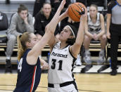UConn's Dorka Juhász blocks a layup made by Providence's Olivia Olsen (31) during the second half of an NCAA college basketball game, Wednesday, Feb. 1, 2023, in Providence, R.I. (AP Photo/Mark Stockwell)
