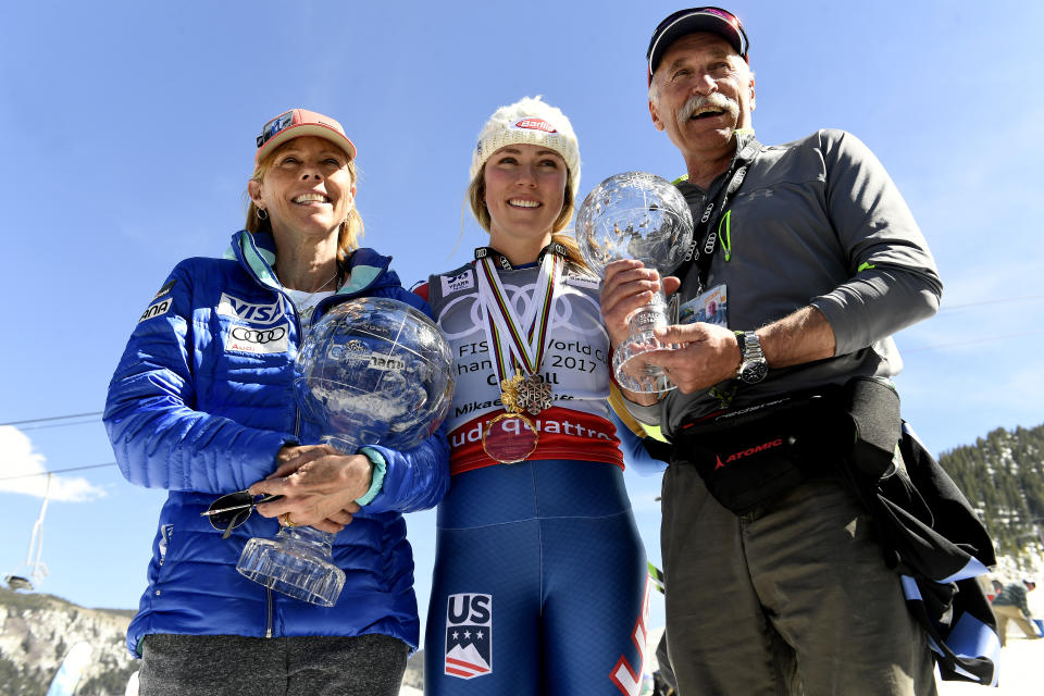 ASPEN, CO - MARCH 19: Mikaela Shiffrin stands with her parents Eileen, left, and Jeff Shiffrin, right, as they hold her overall World Cup Crystal Globe trophy, left, and her World Cup crystal globe for slalom, in her dad's hands at the base of Aspen Mountain after the 2017 Audi FIS Ski World Cup Finals on March 19, 2017 in Aspen, Colorado. (Photo by Helen H. Richardson/The Denver Post via Getty Images)