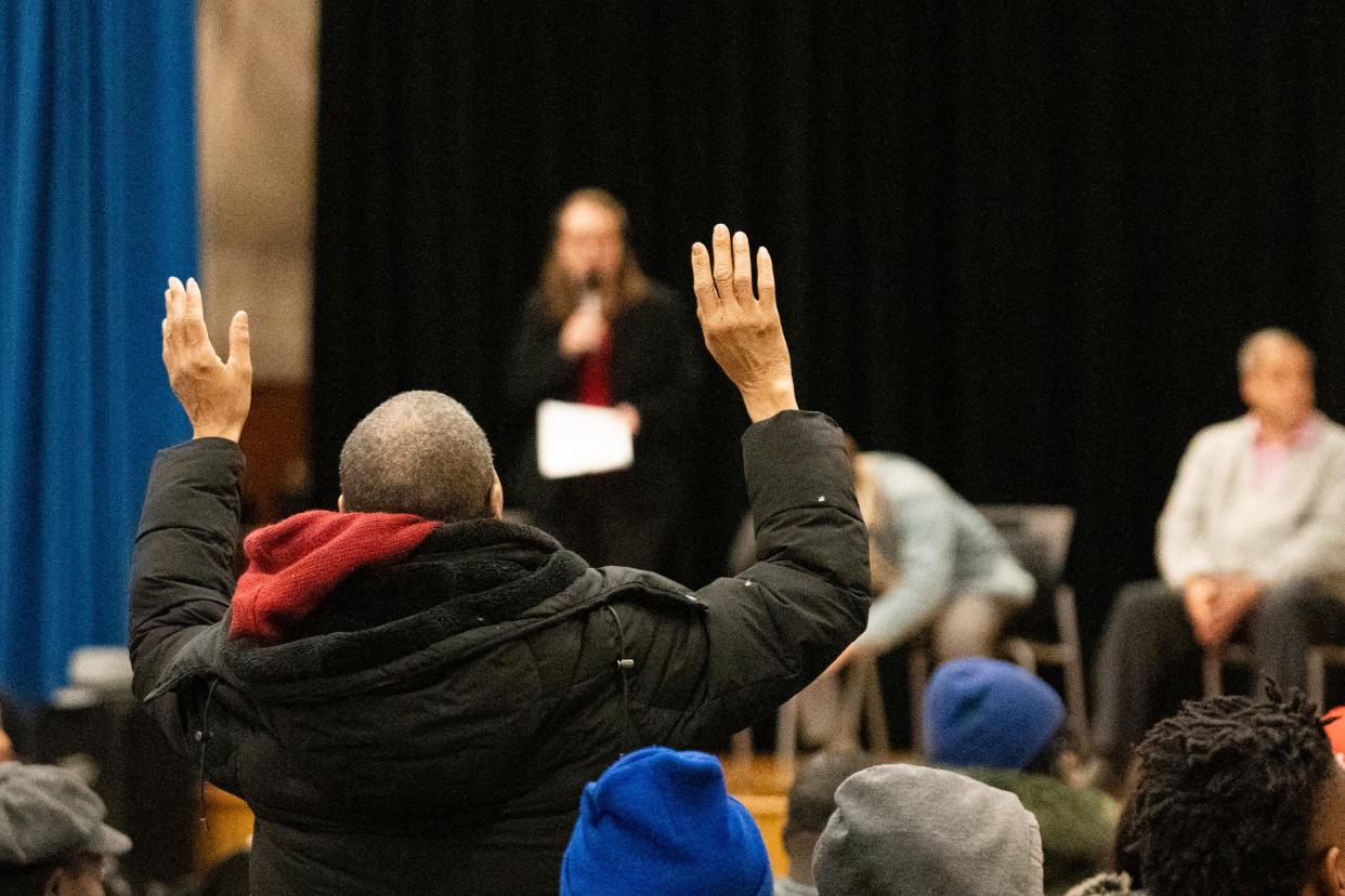 Kimberly Wray waits to get her questions answered during a community meeting held by the city to discuss the relocation of everyone at Colonial Village, including Kimberly's daughter who has a disability and has lived there for 13 years. All 508 units have been told they have to leave by Dec. 31.