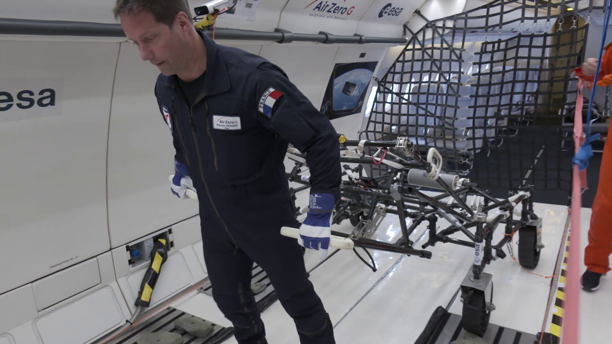  European astronaut Thomas Pesquet testing ESA's lunar wheelbarrow during a parabolic flight simulating lunar gravity in a first-of-a-kind experiment. 