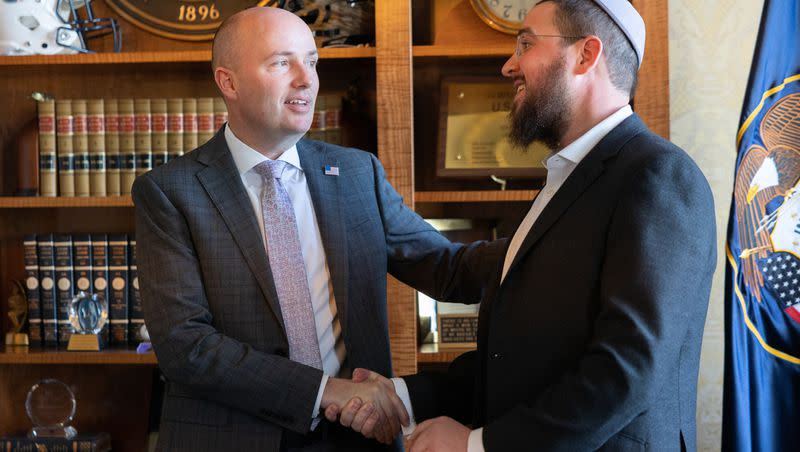 Utah Gov. Spencer Cox shakes Rabbi Avremi Zippel’s hand after an informal meeting at the Utah state Capitol in Salt Lake City on Monday, April 10, 2023.