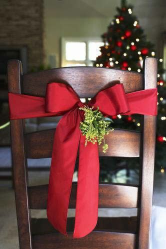 Don’t forget to decorate the chairs. That will give your dining room an instant festive boost. [Photo: Pinterest]