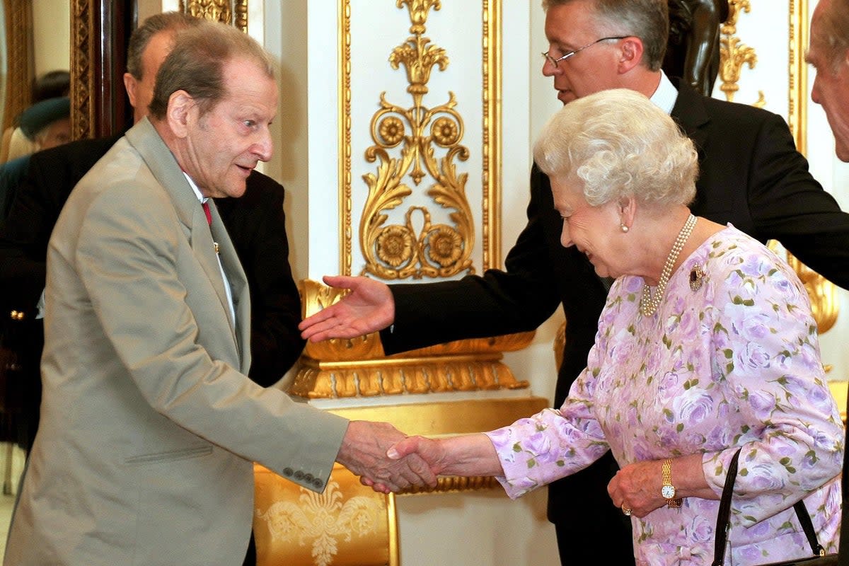 Queen Elizabeth II shakes hands with artist, Lucian Freud before lunch for members of the Order of Merit at Buckingham Palace in London (John Stillwell/PA) (PA Archive)