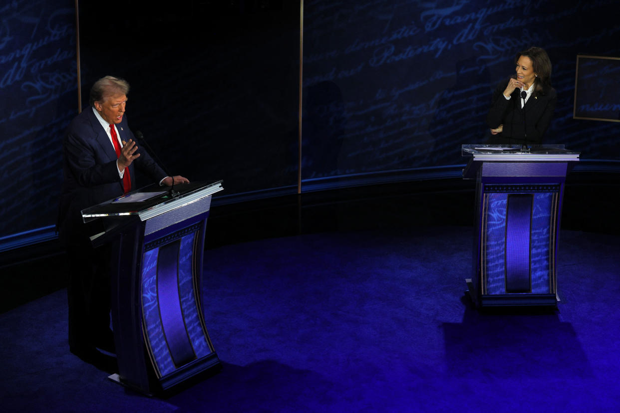 Republican presidential nominee, former U.S. President Donald Trump speaks as Democratic presidential nominee, U.S. Vice President Kamala Harris listens as they attend a presidential debate hosted by ABC in Philadelphia, Pennsylvania, U.S., September 10, 2024. REUTERS/Brian Snyder