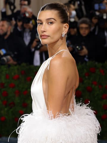 <p>Mike Coppola/Getty</p> Hailey Bieber attends the 2022 Met Gala