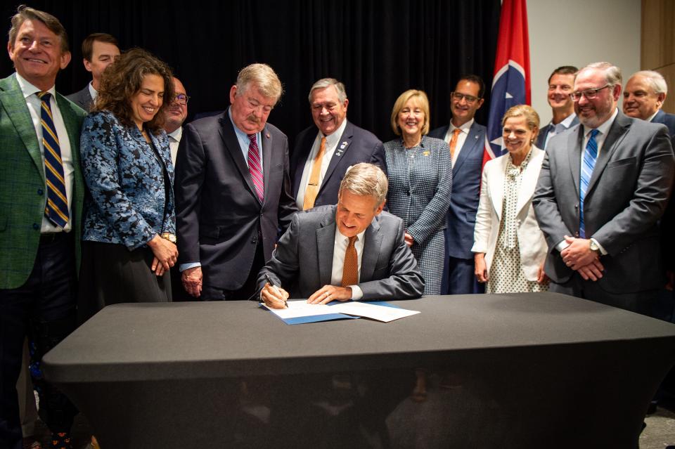 Tennessee Gov. Bill Lee signs an executive order creating the Tennessee Nuclear Energy Advisory Council during an event at the Zeanah Engineering Complex on the University of Tennessee's campus in Knoxville on May 16, 2023.