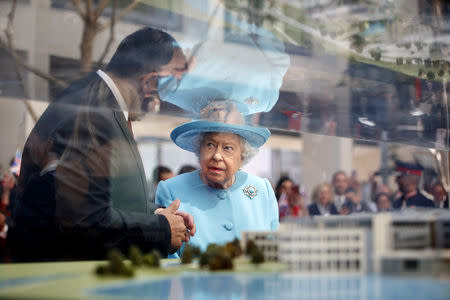 Britain's Queen Elizabeth views a model building during her visit to the headquarters of British Airways, as British Airways mark their centenary year, in Heathrow, west London, Britain May 23, 2019. Tolga Akmen/Pool via REUTERS