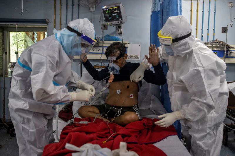 Medical workers treat patients infected with the coronavirus disease (COVID-19) at a hospital in New Delhi