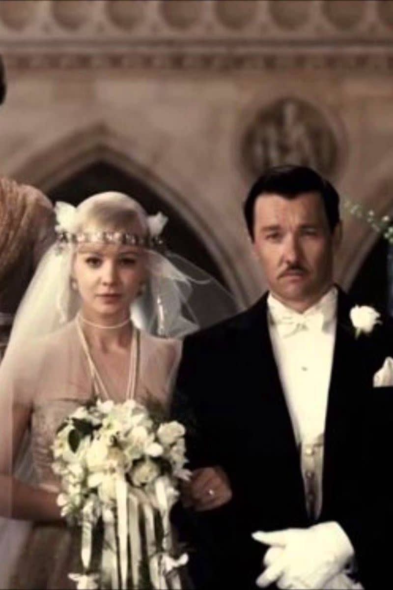 <p>It may not have been the happiest of marriages, but Daisy Buchanan's (Carey Mulligan) 1920s-era wedding gown in <em>The Great Gatsby</em> was simply marvelous. From the jeweled headband to the chiffon cap sleeves, it's no wonder the film's costume designer, Catherine Martin, took <a href="http://fashion.telegraph.co.uk/news-features/TMG10658344/Oscars-2014-How-Catherine-Martin-put-the-Great-into-Gatsbys-costumes.html" rel="nofollow noopener" target="_blank" data-ylk="slk:home an Oscar for her work;elm:context_link;itc:0;sec:content-canvas" class="link ">home an Oscar for her work</a>.<br></p>