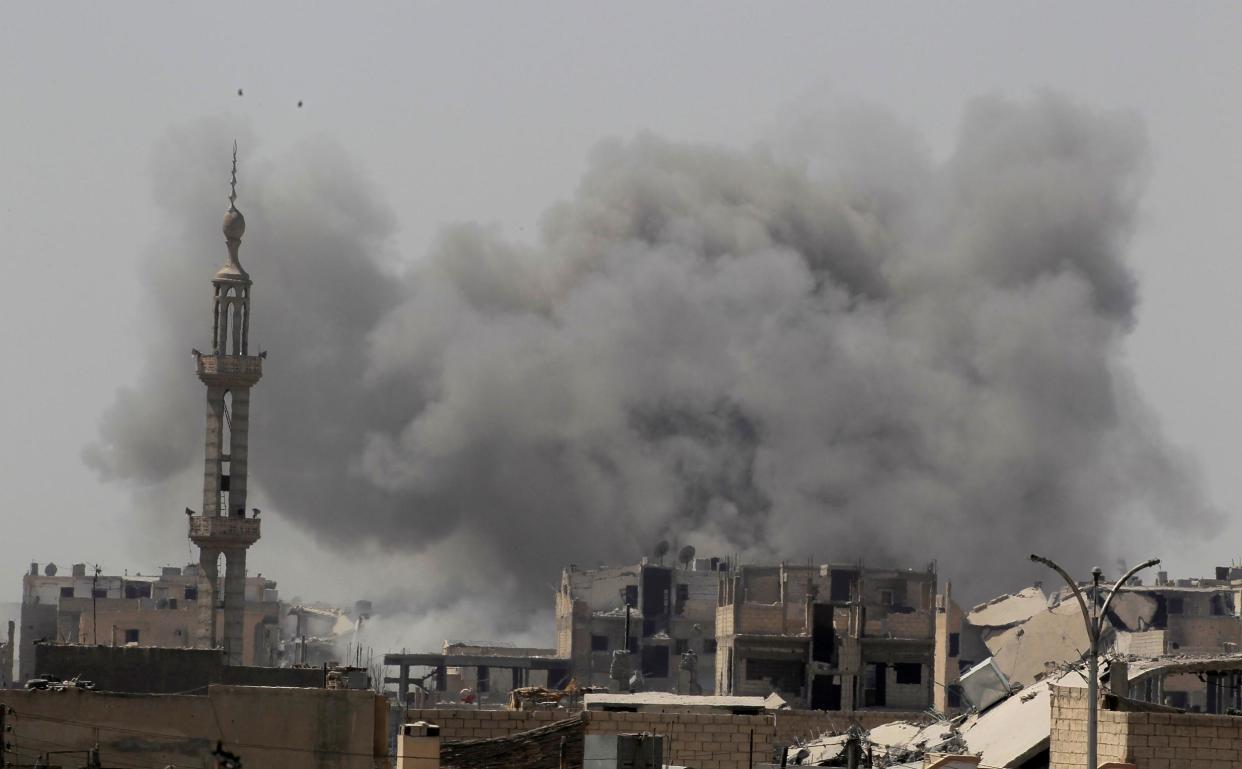 Smoke rises after an air strike during fighting between members of the US-backed Syrian Democratic Forces and Isis in Raqqa on 20 August 2017: Reuters