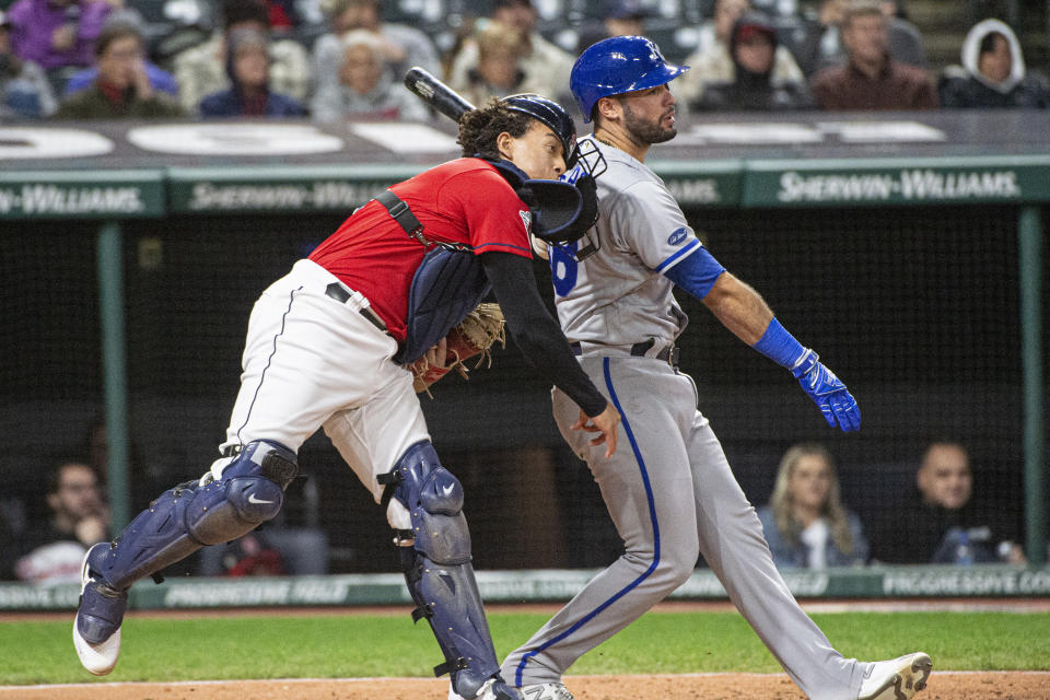 Cleveland Guardians' Bo Naylor throws to second base on a steal by Kansas City Royals' Bobby Witt Jr. stealing, as Vinnie Pasquantino tries to move away during the eighth inning of a baseball game in Cleveland, Saturday, Oct. 1, 2022. (AP Photo/Phil Long)