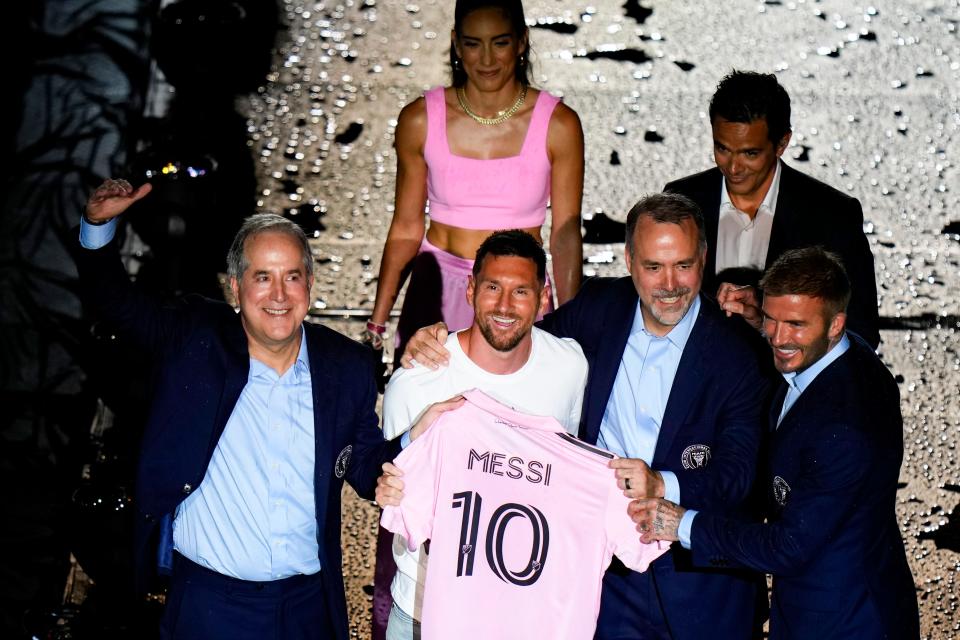 Lionel Messi is introduced at The Unveil event with Inter Miami CF managing owner Jorge Mas, co-owner Jose Mas, and co-owner David Beckham at DRV PNK Stadium.