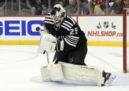 New Jersey Devils goaltender Mackenzie Blackwood (29) stops the puck during the second period of the team's NHL hockey game against the Philadelphia Flyers on Wednesday, Dec. 8, 2021, in Newark, N.J. (AP Photo/Bill Kostroun)