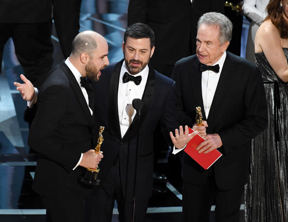 HOLLYWOOD, CA - FEBRUARY 26:  'La La Land' producer Jordan Horowitz (L) announces actual Best Picture winner as 'Moonlight' after a presentation error with host Jimmy Kimmel and actor Warren Beatty onstage during the 89th Annual Academy Awards at Hollywood & Highland Center on February 26, 2017 in Hollywood, California.  (Photo by Kevin Winter/Getty Images)