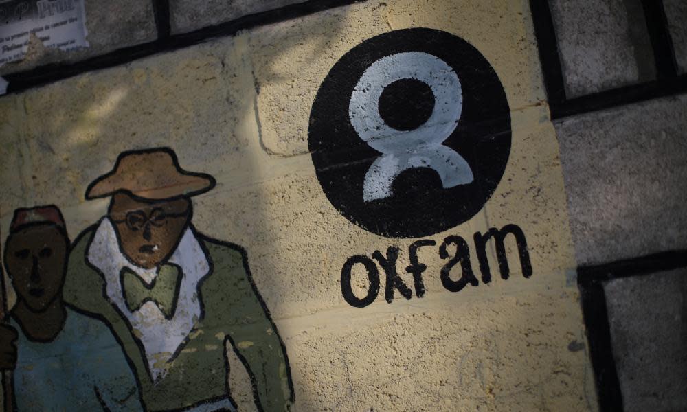 An Oxfam sign is seen on a wall in Corail, a camp established on the outskirts of Port-au-Prince for people displaced by the earthquake that hit Haiti in 2010