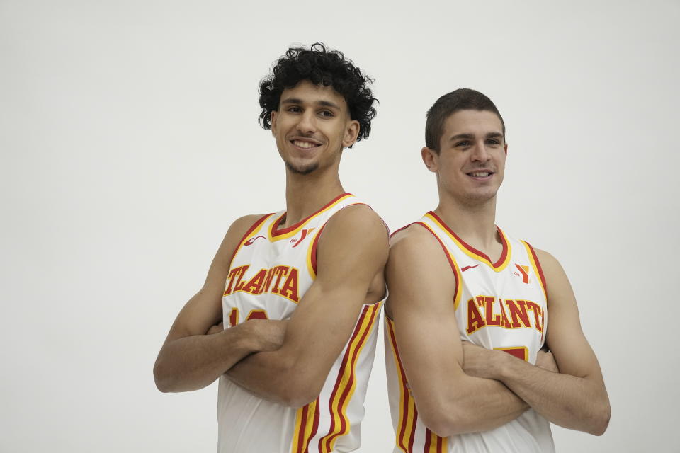 Atlanta Hawks' Zaccharie Risacher, left and Nikola Djurišić, right, poses for a photograph after a news conference, Friday, June 28, 2024, in Atlanta. Risacher was selected as the first overall pick by the Atlanta Hawks in the first round of the NBA basketball draft. AP Photo/Brynn Anderson)