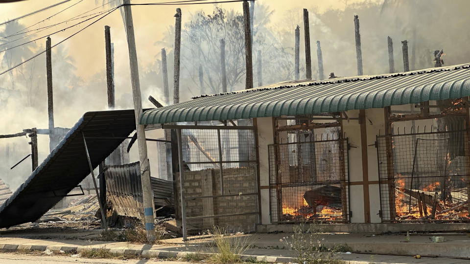 In this photo released by the Free Burma Rangers, a building burns in Pasaung, Karenni state, Myanmar in March, 2024, after a Burmese military airstrike and mortars destroyed the town. (Free Burma Rangers via AP)