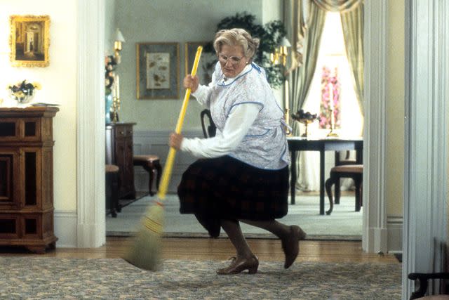 <p>20th Century-Fox/Getty</p> Robin Williams brooms in a scene from the film 'Mrs. Doubtfire', 1993.