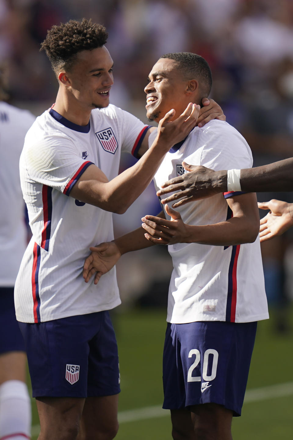 United States' Reggie Cannon, right, receives hug from teammate Antonee Robinson, left, after scoring against Costa Rica in the second half during an international friendly soccer match Wednesday, June 9, 2021, in Sandy, Utah. (AP Photo/Rick Bowmer)