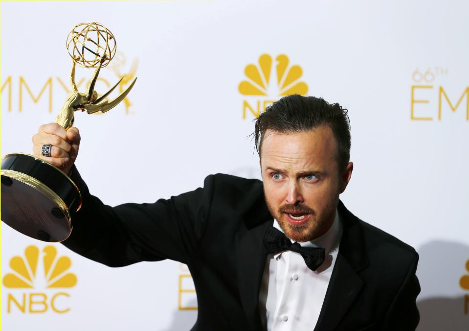 Aaron Paul poses with his Outstanding Supporting Actor in a Drama Series for AMC's "Breaking Bad" at the 66th Primetime Emmy Awards in Los Angeles, California August 25, 2014. REUTERS/Mike Blake (UNITED STATES -Tags: ENTERTAINMENT)(EMMYS-BACKSTAGE)