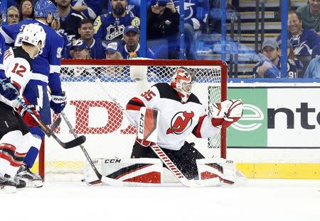 FILE PHOTO: Apr 21, 2018; Tampa, FL, USA; New Jersey Devils goaltender Cory Schneider (35) makes a save against the Tampa Bay Lightning during the second period of game five of the first round of the 2018 Stanley Cup Playoffs at Amalie Arena. Mandatory Credit: Kim Klement-USA TODAY Sports/File Photo