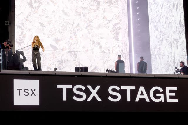 <p>Kevin Mazur/Getty</p> Shakira performs in Times Square in New York City on March 26, 2024