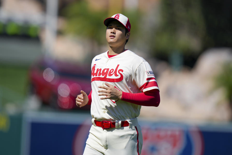 Los Angeles Angels designated hitter Shohei Ohtani (17) warms up before a baseball game against the Houston Astros in Anaheim, Calif., Sunday, July 16, 2023. (AP Photo/Eric Thayer)