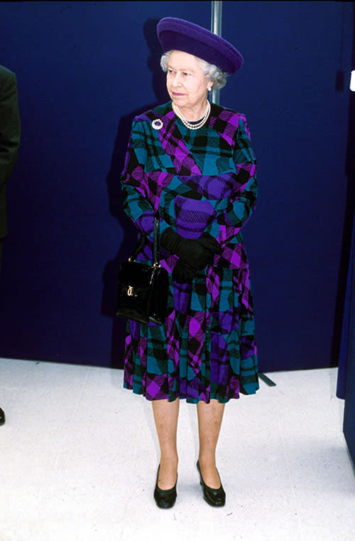 The Queen adds a modern touch to traditional tartan, opting for a colourful purple and turquoise dress for a visit to Nottingham University in 1999.