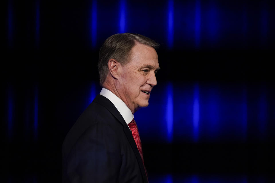 Former Sen. David Perdue arrives before a gubernatorial Republican primary debate, Sunday, May 1, 2022, in Atlanta. (AP Photo/Brynn Anderson, Pool)