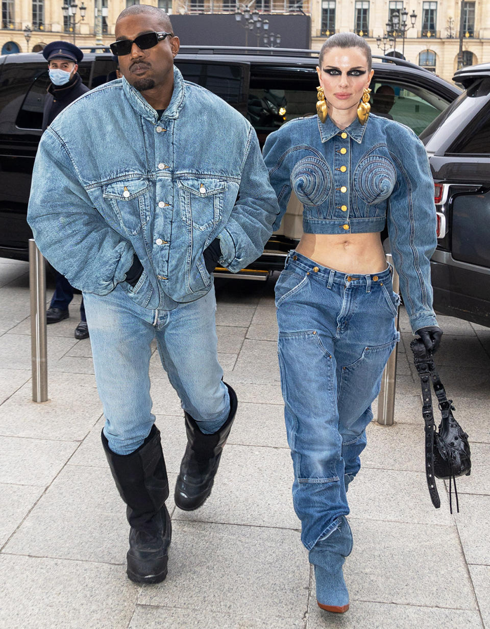 <p>The rapper and the <em>Uncut Gems </em>actress made their relationship <a href="https://people.com/style/kanye-west-julia-fox-red-carpet-debut-matching-denim-paris-fashion-week/" rel="nofollow noopener" target="_blank" data-ylk="slk:red carpet official in matching denim ensembles,;elm:context_link;itc:0;sec:content-canvas" class="link ">red carpet official in matching denim ensembles,</a> which they both paired with black gloves while attending Paris Men's Fashion Week. </p>