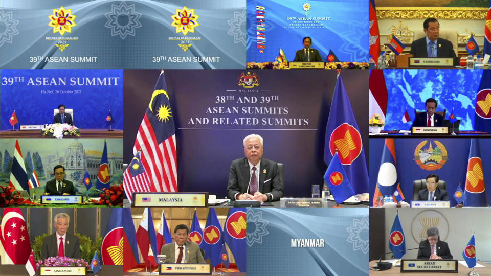 In this image released on Tuesday, Oct. 26, 2021, by Brunei ASEAN Summit in Bandar Seri Begawan, Malaysian Prime Minister Ismail Sabri Yaakob, center, speaks during a virtual summit with the leaders of the Association of Southeast Asian Nations (ASEAN) member​ states. Southeast Asian leaders began their annual summit without Myanmar on Tuesday amid a diplomatic standoff over the exclusion of the leader of the military-ruled nation from the group's meetings. An empty box of Myanmar is seen at bottom second from right. (Brunei ASEAN Summit via AP)