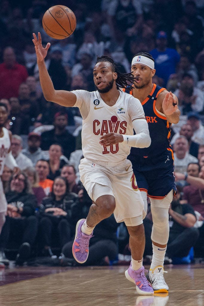 Cleveland Cavaliers' Darius Garland (10) grabs a pass in front of New York Knicks' Josh Hart (3) during the first half of Game 5 of an NBA basketball first-round playoff series Wednesday, April 26, 2023, in Cleveland. (AP Photo/Phil Long)