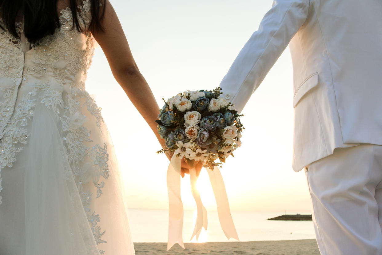 Stock picture of young couple getting married following raising of marriage age. (Getty Images)