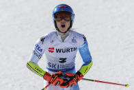 United States' Mikaela Shiffrin celebrates after taking gold in an alpine ski World Championships giant slalom, in Meribel, France, Thursday, Feb. 16, 2023. (AP Photo/Alessandro Trovati)