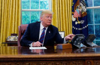 FILE PHOTO - U.S. President Donald Trump talks via speakerphone to Mexican President Enrique Pena Nieto to announce a deal to replace the North American Free Trade Agreement (NAFTA) at the White House in Washington, U.S., August 27, 2018. REUTERS/Kevin Lamarque