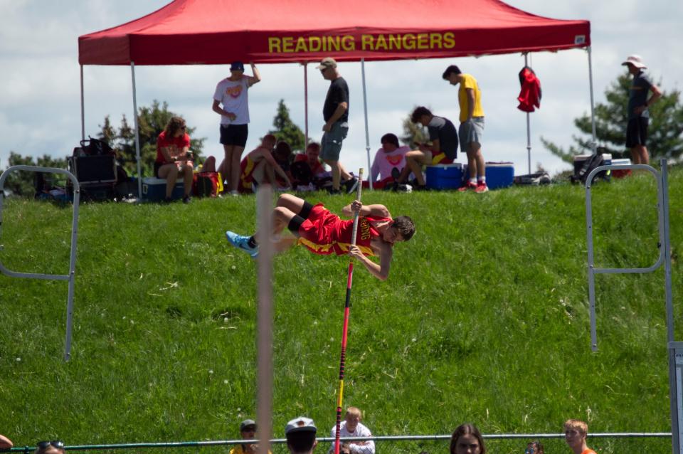 Reading's Hunter Dewey competes in the pole vault.