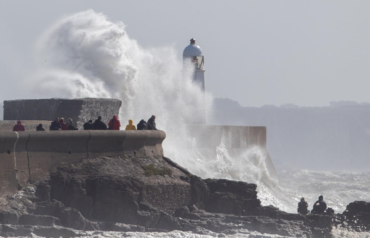 Waves break over the coastline at Porthcawl in Wales, as Storm Aileen brings howling gusts and heavy showers to parts of the UK. (PA)