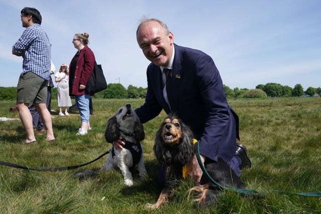 Liberal Democrat leader Ed Davey with Cora and Nelly as he visits Wimbledon Common to celebrate the party’s gains in the 2022 local elections