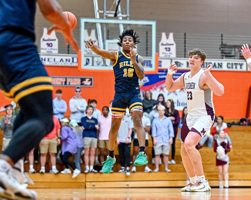 Riley's Marvin Schindler (10) passes the ball in the second half of the sectional game against Mishawaka Saturday, March 4, 2023, at LaPorte High School.