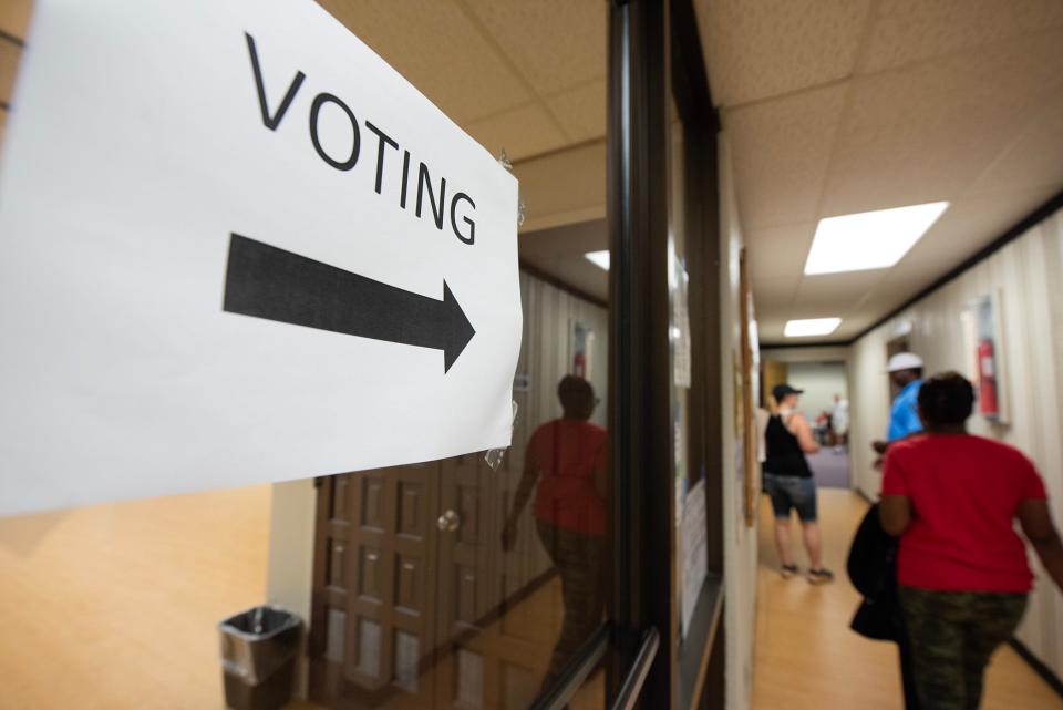 Voters head into the poll at the A.E. Wood Activity and Therapeutic Center in Clinton to cast their ballots during the primary election Tuesday.