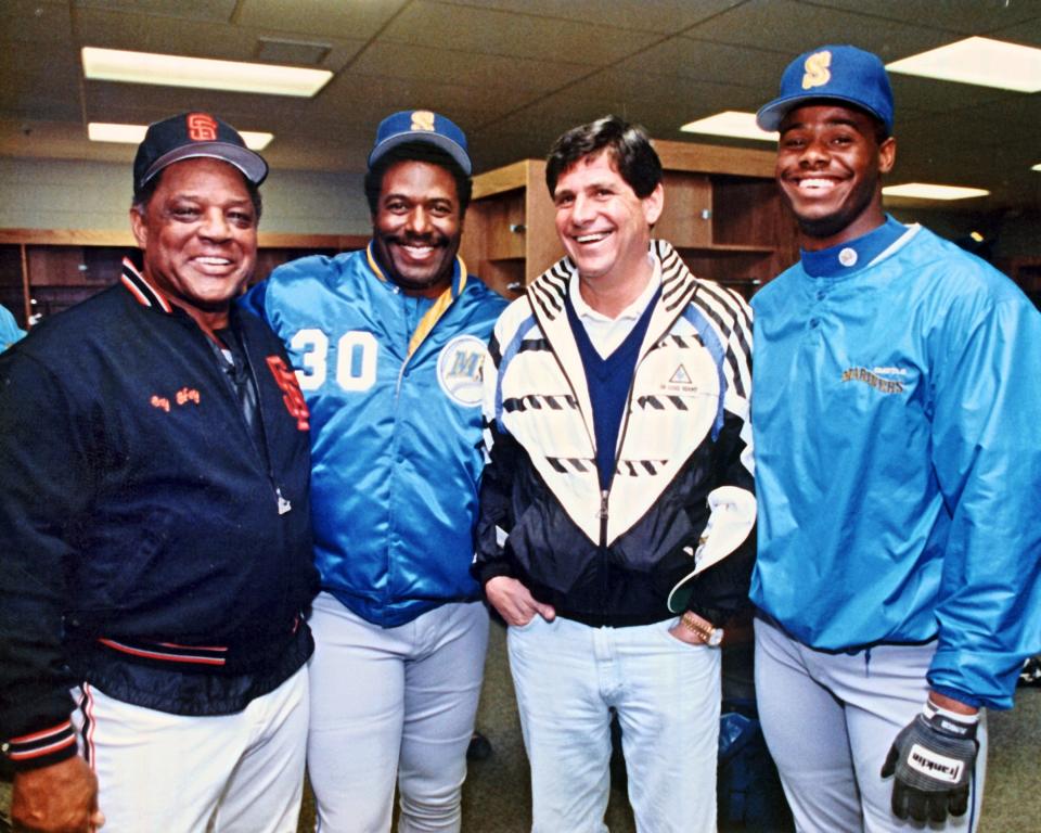 Willie Mays, Ken Griffey Sr., Jeff Smulyan and Ken Griffey, Jr. are shown at a 1991 spring training.