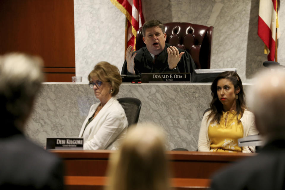 Warren County Common Pleas Judge Donald Oda II sentences Brooke Skylar Richardson, during a hearing, Friday, Sept. 13, 2019, in Lebanon, Ohio. Richardson, acquitted the day before of killing her newborn but convicted of corpse abuse, was sentenced to three years' probation, was sentenced to three years' probation. (Kareem Elgazzar/The Cincinnati Enquirer via AP, Pool)